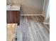 Bathroom featuring granite vanity and laminate wood flooring at 948 Regency Dr, Lawrenceville, GA 30044