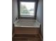 Bright bathroom featuring a built-in soaking tub situated beneath a window with blinds for privacy at 948 Regency Dr, Lawrenceville, GA 30044