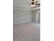 Large bedroom features tray ceiling, neutral paint, and plush carpeting at 948 Regency Dr, Lawrenceville, GA 30044
