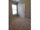 Bright bedroom with a window, neutral walls and plush carpet creates a cozy and inviting atmosphere at 948 Regency Dr, Lawrenceville, GA 30044