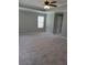Spacious bedroom featuring plush carpeting, neutral paint, and ample natural light at 948 Regency Dr, Lawrenceville, GA 30044