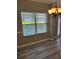 Bright dining room featuring wood floors, chandelier, and a window with blinds at 948 Regency Dr, Lawrenceville, GA 30044