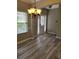 Inviting entryway features wood-style laminate flooring and natural light from the front door at 948 Regency Dr, Lawrenceville, GA 30044
