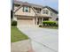 Charming two-story home with a brick and siding exterior and a well-maintained front yard at 948 Regency Dr, Lawrenceville, GA 30044
