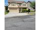 Traditional two-story house featuring an attached two-car garage at 948 Regency Dr, Lawrenceville, GA 30044