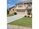 Charming home featuring a two-car garage, landscaped yard, and a welcoming front entrance at 948 Regency Dr, Lawrenceville, GA 30044