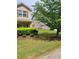 Well-manicured front yard with lush green grass and landscaping at 948 Regency Dr, Lawrenceville, GA 30044