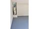 Well-lit garage with a painted floor and modern water heater system at 948 Regency Dr, Lawrenceville, GA 30044