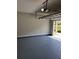Spacious garage with epoxy flooring and automatic door at 948 Regency Dr, Lawrenceville, GA 30044