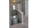Upstairs hallway with a staircase, doors, and neutral walls, offering great natural lighting at 948 Regency Dr, Lawrenceville, GA 30044