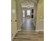 Hallway featuring wood-style laminate floors with an open view to the main living area at 948 Regency Dr, Lawrenceville, GA 30044