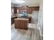 Kitchen showcasing stainless steel appliances, dark wood cabinets, and granite countertops at 948 Regency Dr, Lawrenceville, GA 30044