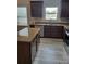 Charming kitchen featuring wood cabinets, granite countertops, and stainless steel appliances at 948 Regency Dr, Lawrenceville, GA 30044