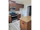 Kitchen featuring stainless steel appliances, granite countertops, and a center island at 948 Regency Dr, Lawrenceville, GA 30044