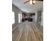Open-concept living room featuring hardwood flooring, recessed lighting, and kitchen access at 948 Regency Dr, Lawrenceville, GA 30044