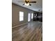 Open-concept living room featuring a kitchen, hardwood floors, and great natural lighting at 948 Regency Dr, Lawrenceville, GA 30044