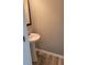 Cozy powder room with stylish pedestal sink and modern fixtures, great for guests at 948 Regency Dr, Lawrenceville, GA 30044