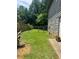 Fenced backyard with mature trees offers a serene outdoor space at 2977 Lowe Ne Trl, Marietta, GA 30066