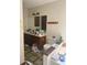 Bathroom with single sink vanity and a commode next to the tub at 2977 Lowe Ne Trl, Marietta, GA 30066