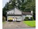 Charming gray two-story home with a two-car garage and well-maintained landscaping at 2977 Lowe Ne Trl, Marietta, GA 30066