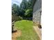 Backyard with fenced lawn and side of home at 2977 Lowe Trail Ne Trl, Marietta, GA 30066
