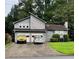 Two-story home with neutral siding, two-car garage, and an ample front yard at 2977 Lowe Trail Ne Trl, Marietta, GA 30066