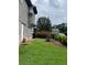 Manicured lawn and side view of home at 2977 Lowe Trail Ne Trl, Marietta, GA 30066