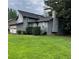 Two-story home with neutral siding, attached two-car garage and manicured lawn at 2977 Lowe Trail Ne Trl, Marietta, GA 30066