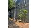 Exterior of home with second story windows and an AC unit at 2977 Lowe Trail Ne Trl, Marietta, GA 30066