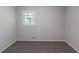 This bedroom features neutral walls and carpeted floors, as well as a window for natural light at 4230 Cheryl Ann Ct, Stone Mountain, GA 30083