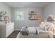 Inviting bedroom with playful decor, soft lighting, and comfortable furnishings at 4230 Cheryl Ann Ct, Stone Mountain, GA 30083