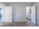Bedroom with gray carpet, two doors, neutral walls, and a double-door closet at 4230 Cheryl Ann Ct, Stone Mountain, GA 30083