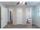 This bedroom has neutral walls and carpeted floors, with two doors leading to other rooms at 4230 Cheryl Ann Ct, Stone Mountain, GA 30083
