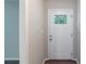 Welcoming entryway with wood floors and a glass-paneled front door at 4230 Cheryl Ann Ct, Stone Mountain, GA 30083