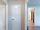 Hallway with views to the kitchen with bright white doors and modern finishes at 4230 Cheryl Ann Ct, Stone Mountain, GA 30083