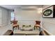 Finished basement featuring gray walls, comfy seating, and fun decor accents at 5105 Vernon Oaks Dr, Dunwoody, GA 30338