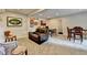 Finished basement with multiple seating areas and a dining table at 5105 Vernon Oaks Dr, Dunwoody, GA 30338