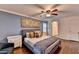 Stylish bedroom features hardwood floors, a ceiling fan, an ensuite bathroom, and great natural lighting at 5105 Vernon Oaks Dr, Dunwoody, GA 30338