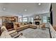 Spacious living area with adjacent kitchen, comfortable seating, fireplace, and an open floor plan at 5105 Vernon Oaks Dr, Dunwoody, GA 30338