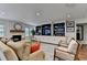 Comfortable living room featuring built-in shelving, a brick fireplace, and cozy seating at 5105 Vernon Oaks Dr, Dunwoody, GA 30338