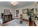 Home office features detailed rug, natural light, and decorative furniture, creating a warm, inviting space at 5105 Vernon Oaks Dr, Dunwoody, GA 30338