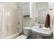 Clean bathroom featuring a shower with white curtain, white vanity, and overhead cabinet for storage at 616 Angier Ne Ave # 4, Atlanta, GA 30308