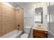 Cozy bathroom with tiled tub and a classic vanity with good lighting at 616 Angier Ne Ave # 4, Atlanta, GA 30308