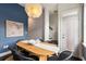 Stylish dining area with unique light fixture and seating for six, perfect for gatherings at 616 Angier Ne Ave # 4, Atlanta, GA 30308