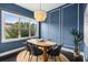 Chic dining room with blue walls, modern chandelier, and a table set for six at 616 Angier Ne Ave # 4, Atlanta, GA 30308