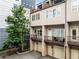Rear exterior view showing balconies with garage entrances on the lower level and plenty of parking at 616 Angier Ne Ave # 4, Atlanta, GA 30308
