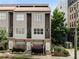 A front exterior view showcasing the townhome's modern facade, private balconies, and well-maintained landscaping at 616 Angier Ne Ave # 4, Atlanta, GA 30308