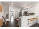 Open kitchen area with gray cabinetry, quartz countertops, stainless appliances, and breakfast bar at 616 Angier Ne Ave # 4, Atlanta, GA 30308
