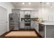 Bright kitchen featuring stainless steel appliances, gray cabinets, and quartz countertops at 616 Angier Ne Ave # 4, Atlanta, GA 30308