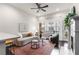 Inviting living room with a cozy sofa, fireplace, and a large window offering natural light at 616 Angier Ne Ave # 4, Atlanta, GA 30308